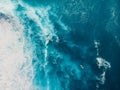 Blue ocean with waves and foam. Aerial view with surfer and sea Royalty Free Stock Photo