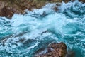 Blue ocean with white-crested waves in a rocky shoreline Royalty Free Stock Photo