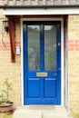 Blue Old Door With Orange Bricky Wall