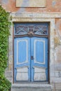 Blue old fashioned wooden door on colored facade. Tallinn. Royalty Free Stock Photo