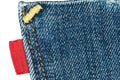 Blue old jeans pocket with empty red label Royalty Free Stock Photo