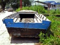 Blue Old River Boat next to the river Royalty Free Stock Photo