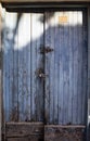 Blue, old, rusty, typical locked wooden door Royalty Free Stock Photo