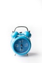Blue old style alarm clock on white background Royalty Free Stock Photo