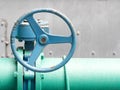 Blue old valve and old green pipe. Industrial water valve Royalty Free Stock Photo