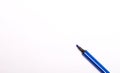 Blue open felt-tip pen on white background. Copy space