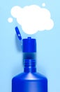 Blue open shampoo bottle and balloon for text over it on a light blue background. vertical view Royalty Free Stock Photo