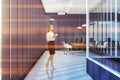 Blue open space office interior, glass wall, woman Royalty Free Stock Photo