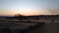 Blue and orange African winter sunset over a farm landscape Royalty Free Stock Photo