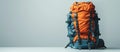Blue and Orange Backpack on Table Royalty Free Stock Photo