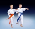 With blue and orange belt athletes are beating punch arm
