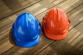 blue, orange hard safety helmet construction hat for safety project of workman as engineer or worker Royalty Free Stock Photo