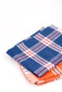 Blue and orange new kitchen dishtowels over white background Royalty Free Stock Photo