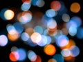 Blue and orange round blurred lights abstract on a black background Royalty Free Stock Photo