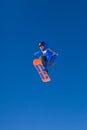 Blue And Orange Snowboarder Mid Air