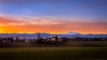 Blue, Orange and Yellow Sky at Sunrise over Mount Baker viewed from the Fraser Valley in British Columbia, Canada Royalty Free Stock Photo