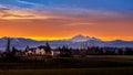 Blue, Orange and Yellow Sky at Sunrise over Mount Baker viewed from the Fraser Valley in British Columbia, Canada Royalty Free Stock Photo