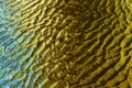 Blue-orange-yellow water reflections with waves and highlights Royalty Free Stock Photo