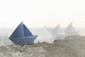 Blue origami ship is the leadership of all white ships, a good business teamwork concept