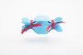 Blue original candy package with red ribbons