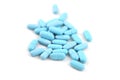 Blue oval pills closeup with sofl natural shadows on white background Royalty Free Stock Photo