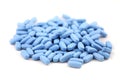 Blue oval pills closeup with sofl natural shadows on white background Royalty Free Stock Photo