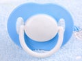 Blue pacifier, close-up Royalty Free Stock Photo