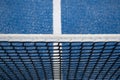 Blue paddle tennis net and court field background Royalty Free Stock Photo