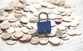 Blue padlock and coins. Finance. Security