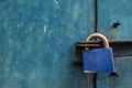 Blue padlock on steel door Royalty Free Stock Photo