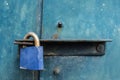 Blue padlock on steel door. Royalty Free Stock Photo