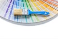 Blue paint brush onopened pantone color palette guide isolated Royalty Free Stock Photo