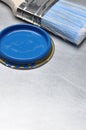 Blue paint can lid with brush Royalty Free Stock Photo