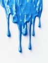 A blue paint drips down a white background Royalty Free Stock Photo