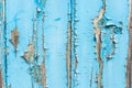 Blue paint flaking off wooden panel background Royalty Free Stock Photo