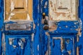 Blue paint peeling off an old wooden door Royalty Free Stock Photo