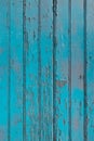 Blue paint peeling off of an old wooden surface texture Royalty Free Stock Photo