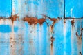 Blue paint peeling off the rusty metal surface Royalty Free Stock Photo