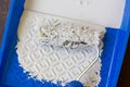Blue paint tray with paint roller and paint inside it. Royalty Free Stock Photo