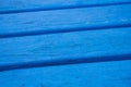 Blue paint on a wooden background Royalty Free Stock Photo