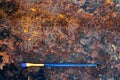 Blue paintbrush on old rusty table, flat lay Royalty Free Stock Photo