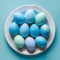 Blue painted eggs arranged on plate, top view Easter composition Royalty Free Stock Photo