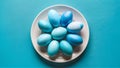 Blue painted eggs arranged on plate, top view Easter composition Royalty Free Stock Photo