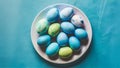 Blue painted eggs arranged on plate, top view Easter composition Royalty Free Stock Photo