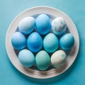 Blue painted eggs arranged on plate, top view Easter composition Royalty Free Stock Photo