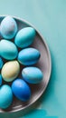 Blue painted eggs arranged on plate, top view Easter composition Royalty Free Stock Photo