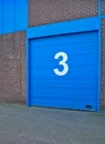 Blue painted garage door in an old building Royalty Free Stock Photo