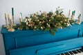 Blue painted old piano decorated with Christmas garland Royalty Free Stock Photo