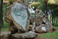 Blue painted rock near the entrance of a Cuban public park