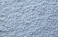 Blue painted roughcast stucco wall